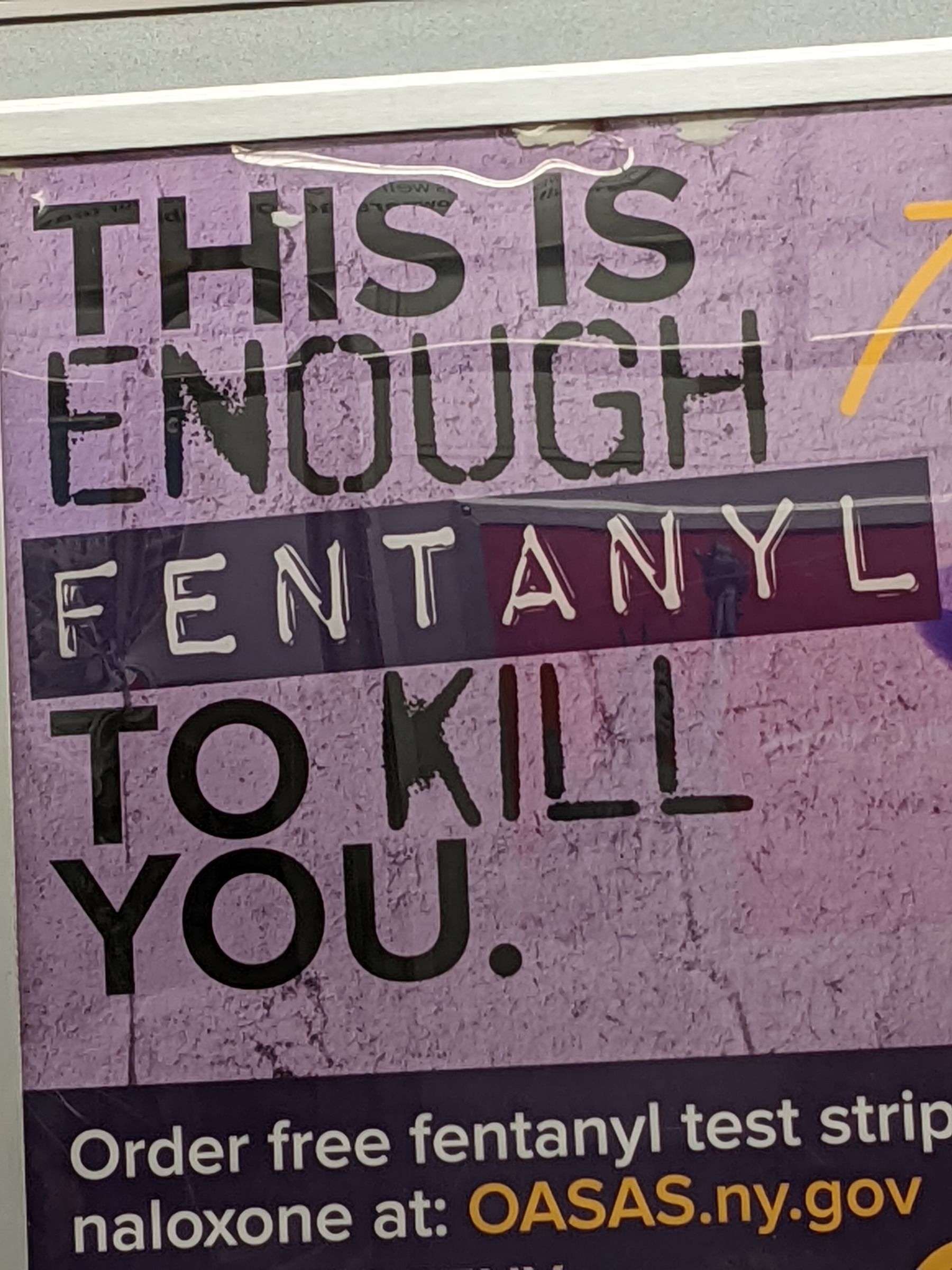 Photo of a drug PSA poster that reads "This is enough fentanyl to kill you". The word "fentanyl" is in the scary label maker font.